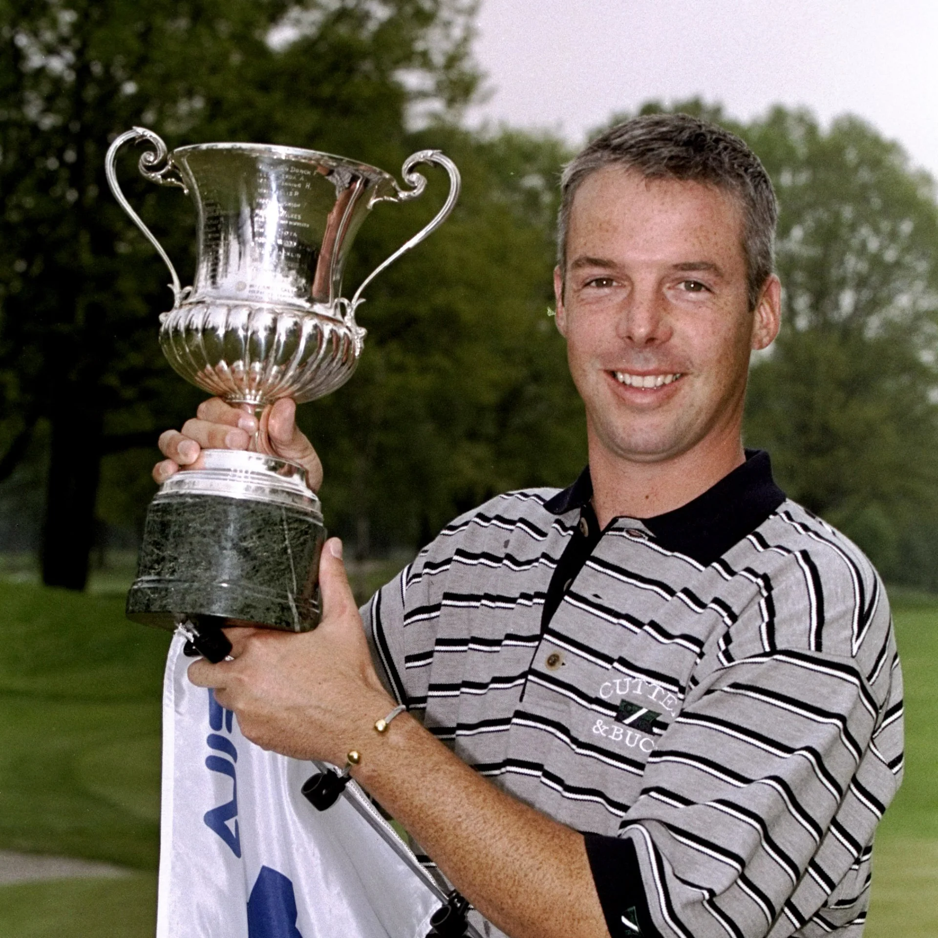 Dean Robertson of Scotland holds the trophy after winning the 1999 Fiat and Fila Italian Open Golf played at the Circolo Golf Club, Turin, Italy. 