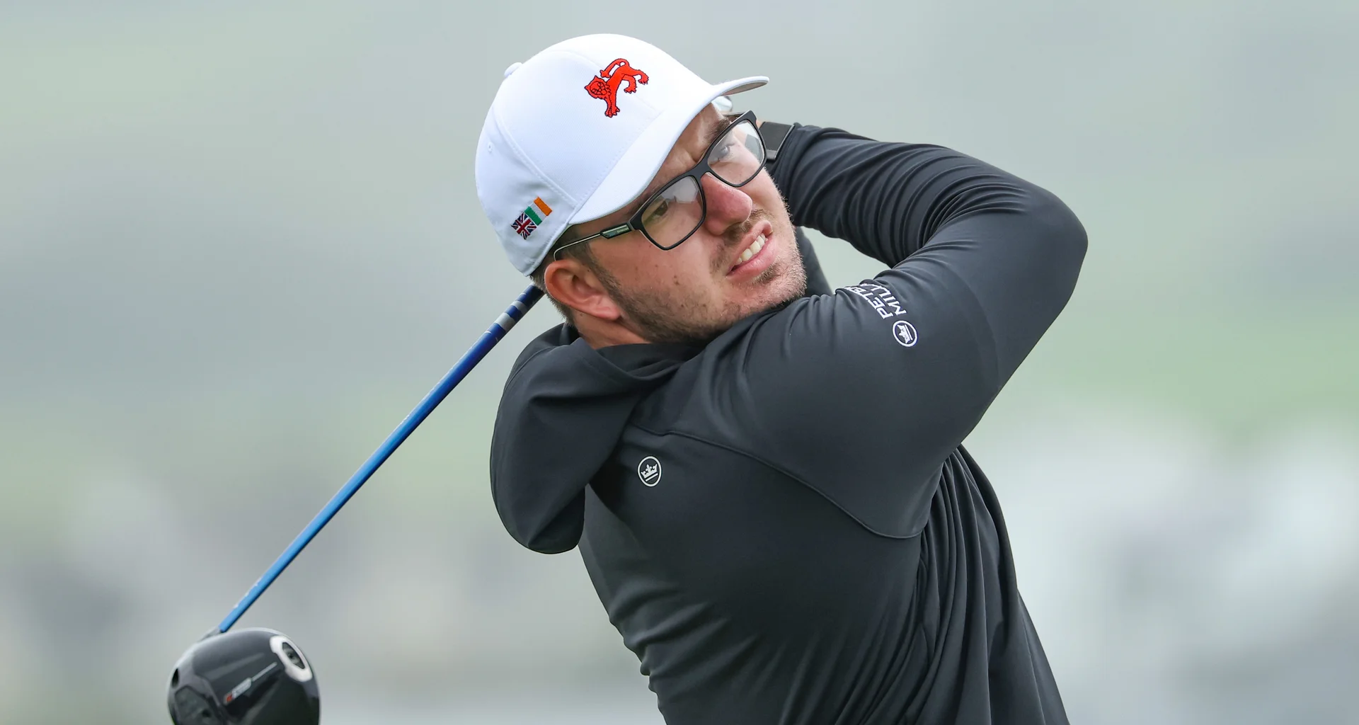 Eliot Baker playing a golf shot during the Walker Cup.