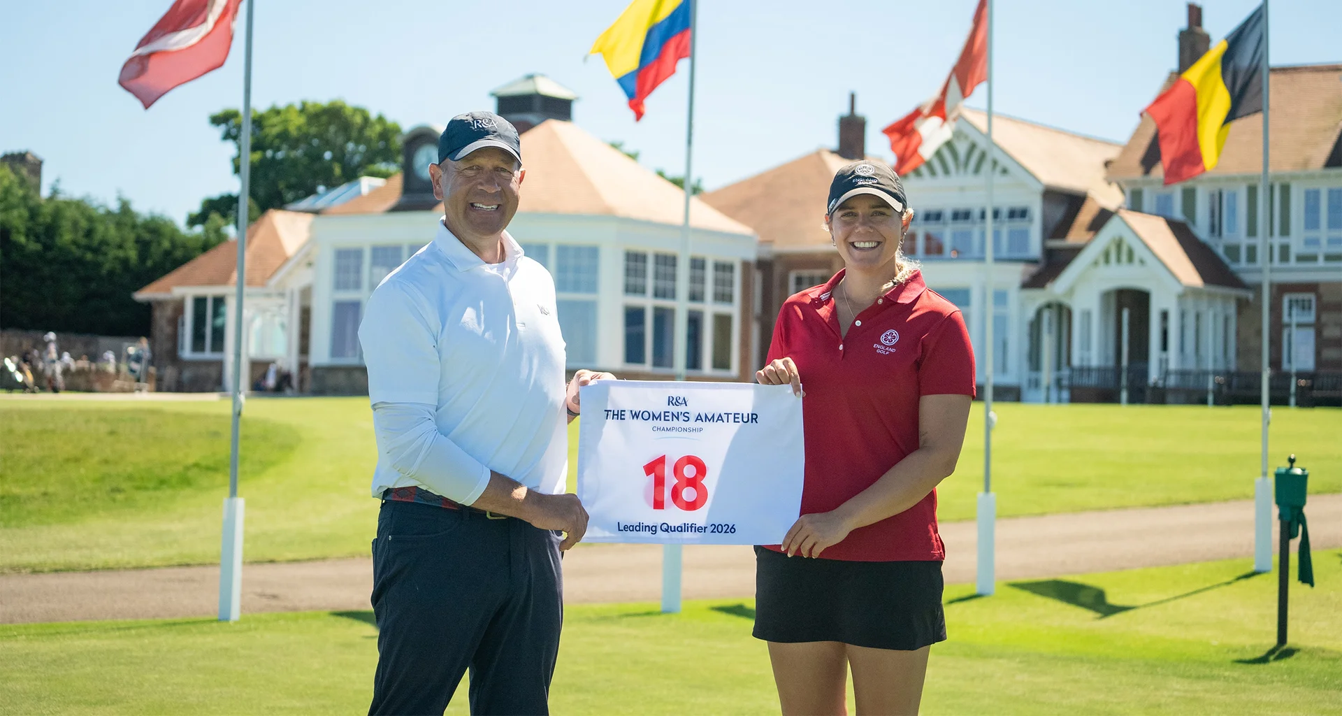 Lily Hirst receives a pin flag from The R&A Director of Championships Charlie Maran to acknowledge finishing top of the stroke play qualifier at The Women's Amateur Championship.