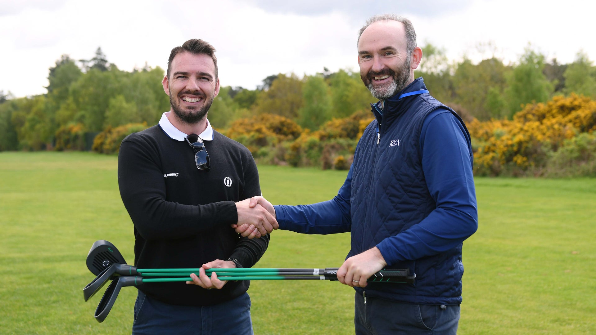 Kevin Barker (right) of The R&A presents a GolfWay donation to Steve Muggridge of the NHS at Woburn.