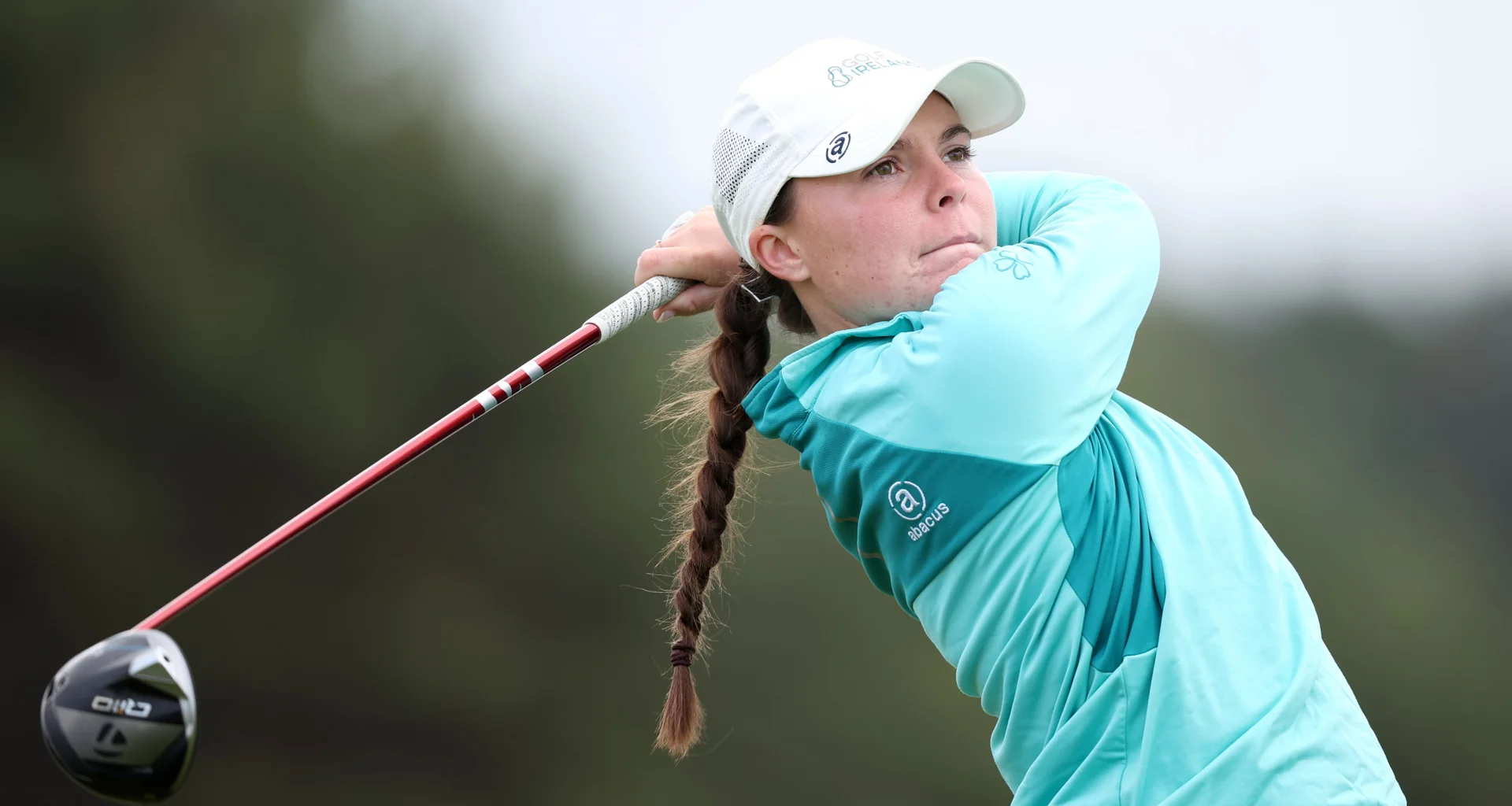 Beth Coulter hitting a golf shot.