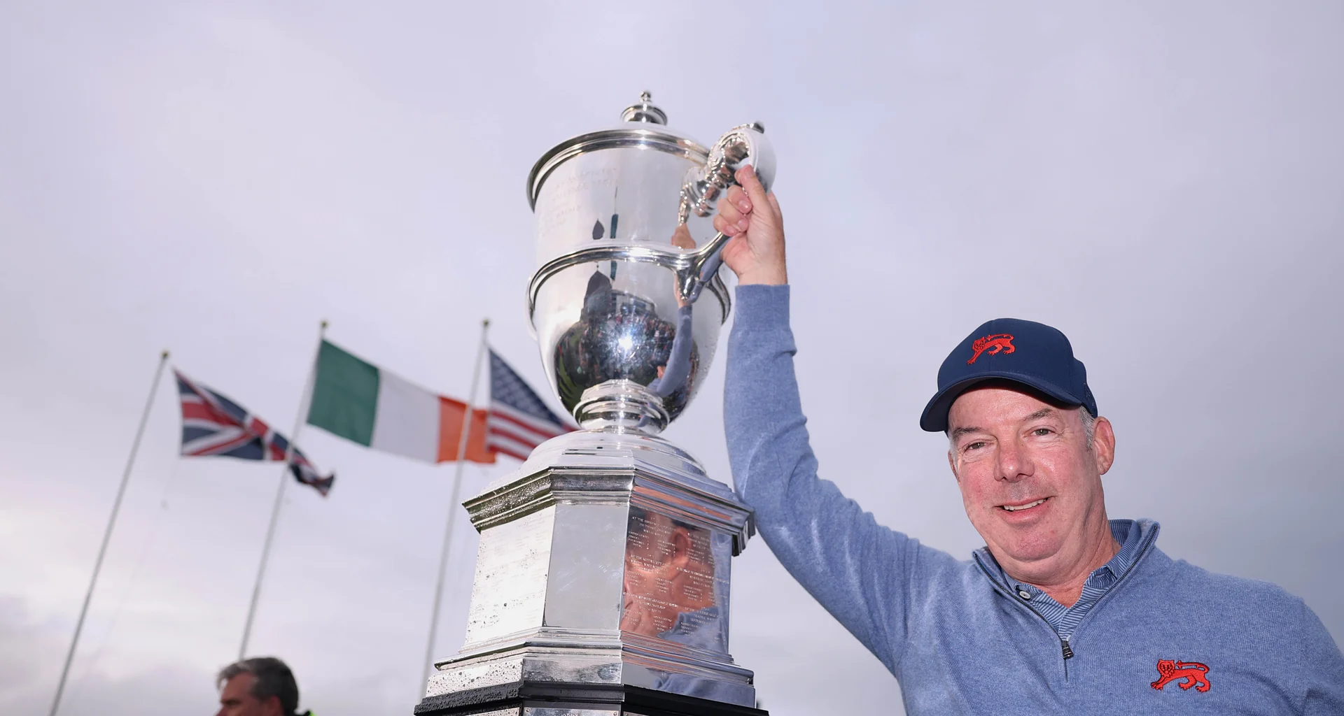 GB&I captain Dean Robertson holds aloft the Walker Cup.