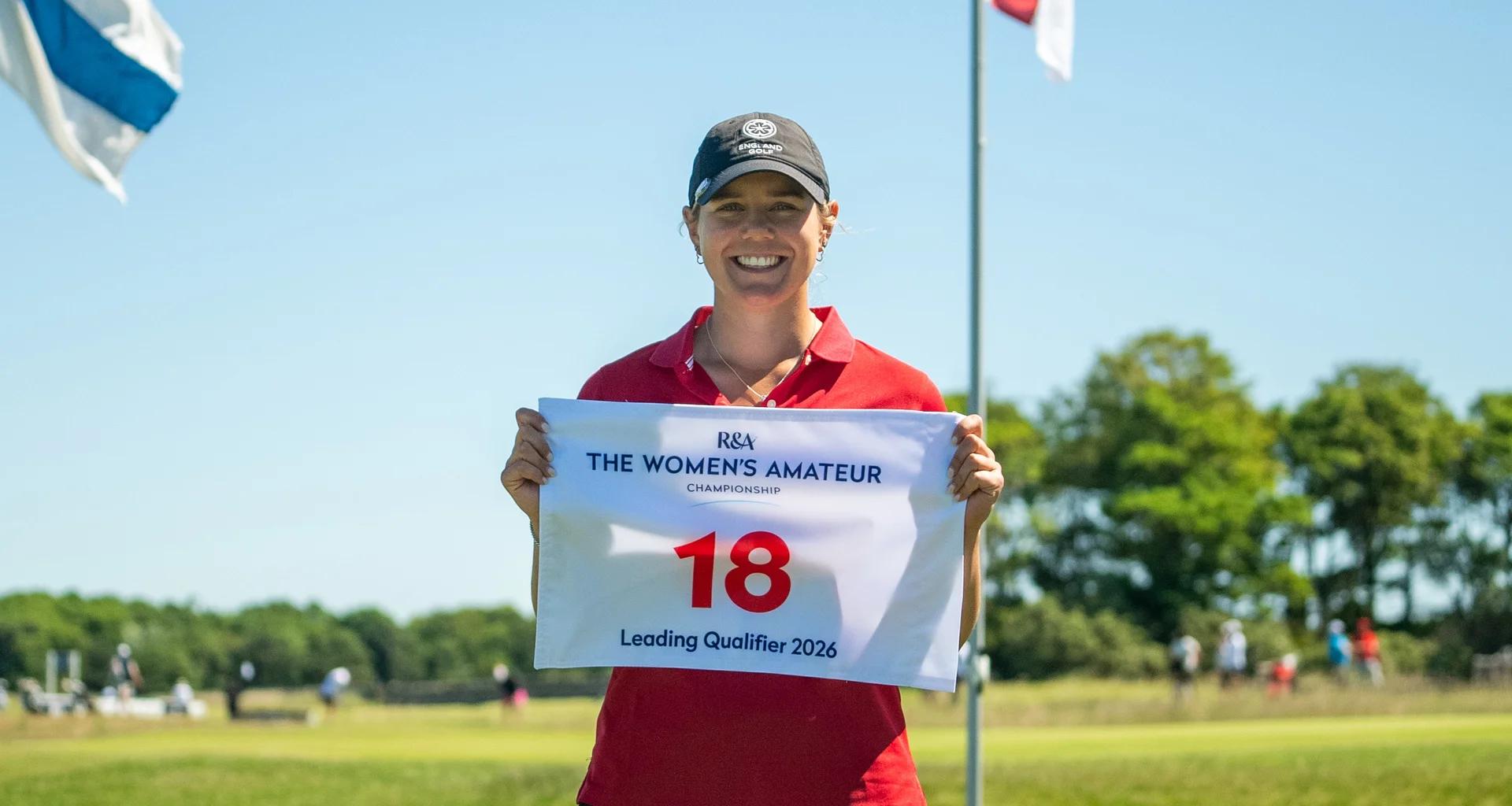 Lily Hirst with a pin flag acknowledging her finishing top of the stroke play qualifier at The Women's Amateur Championship.