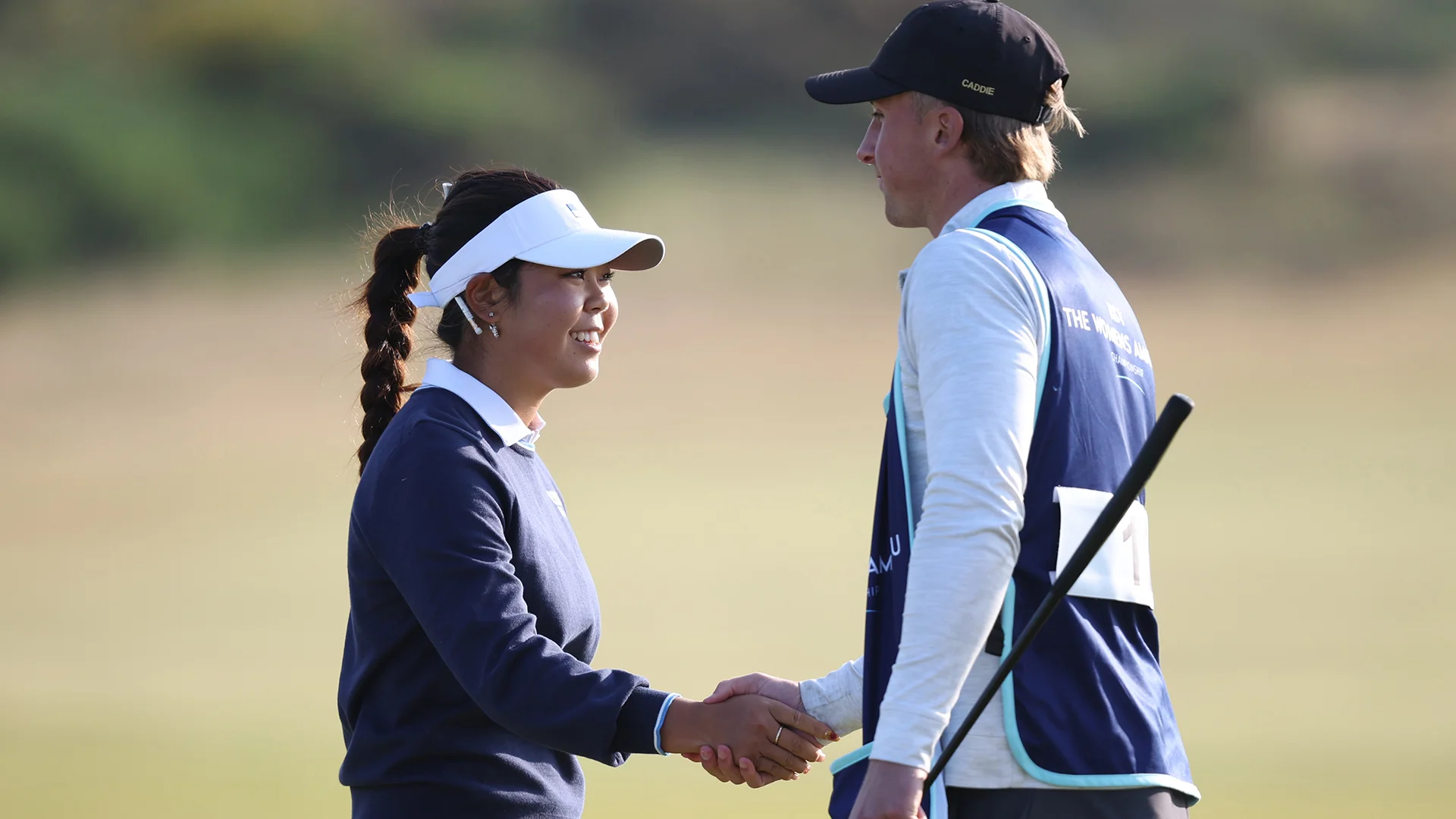 Jasmine Koo shakes hands with her caddie after her second round at Nairn.