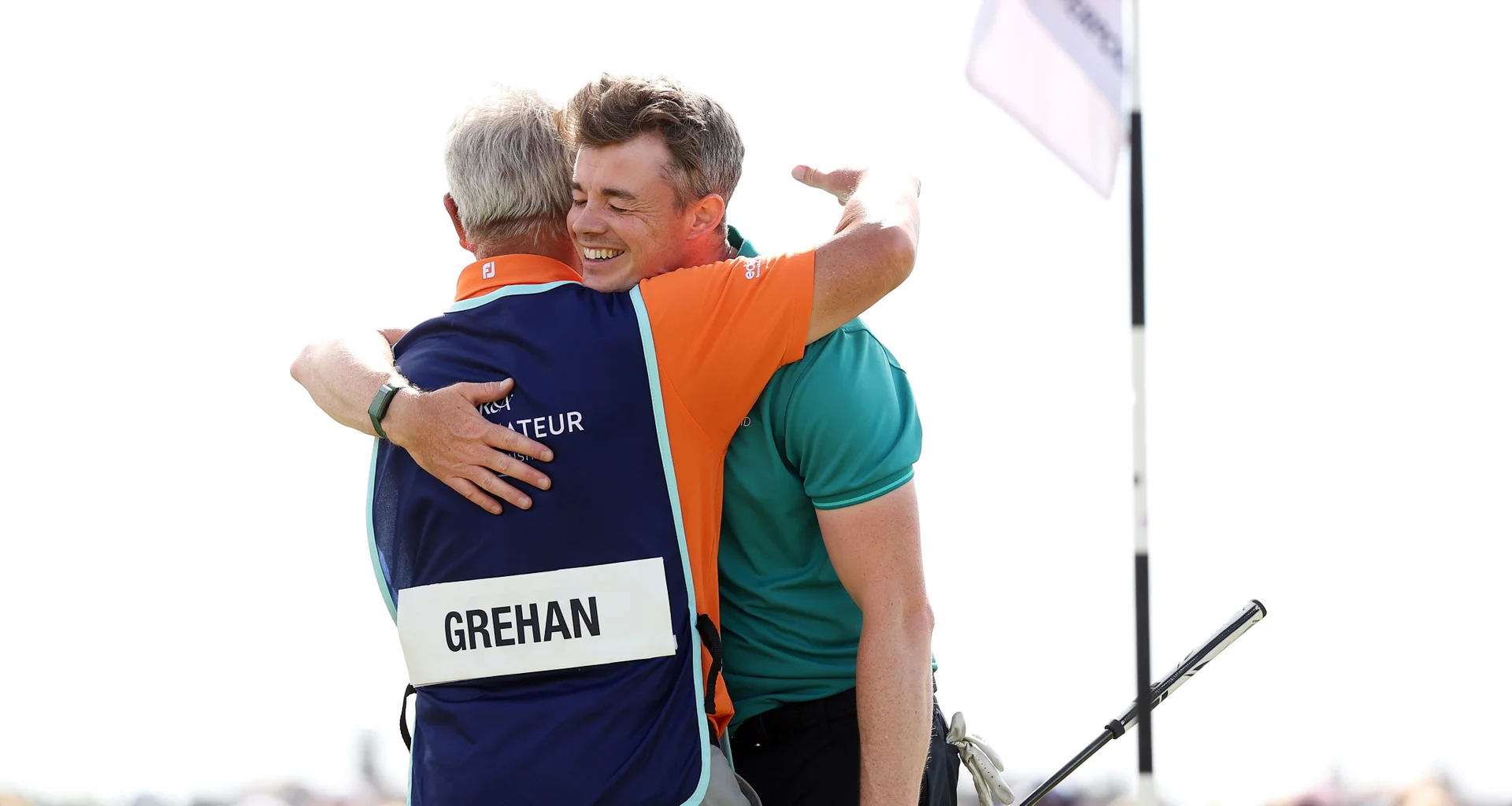 Stuart Grehan celebrates with his caddie after winning The 131st Amateur Championship at Royal Liverpool.