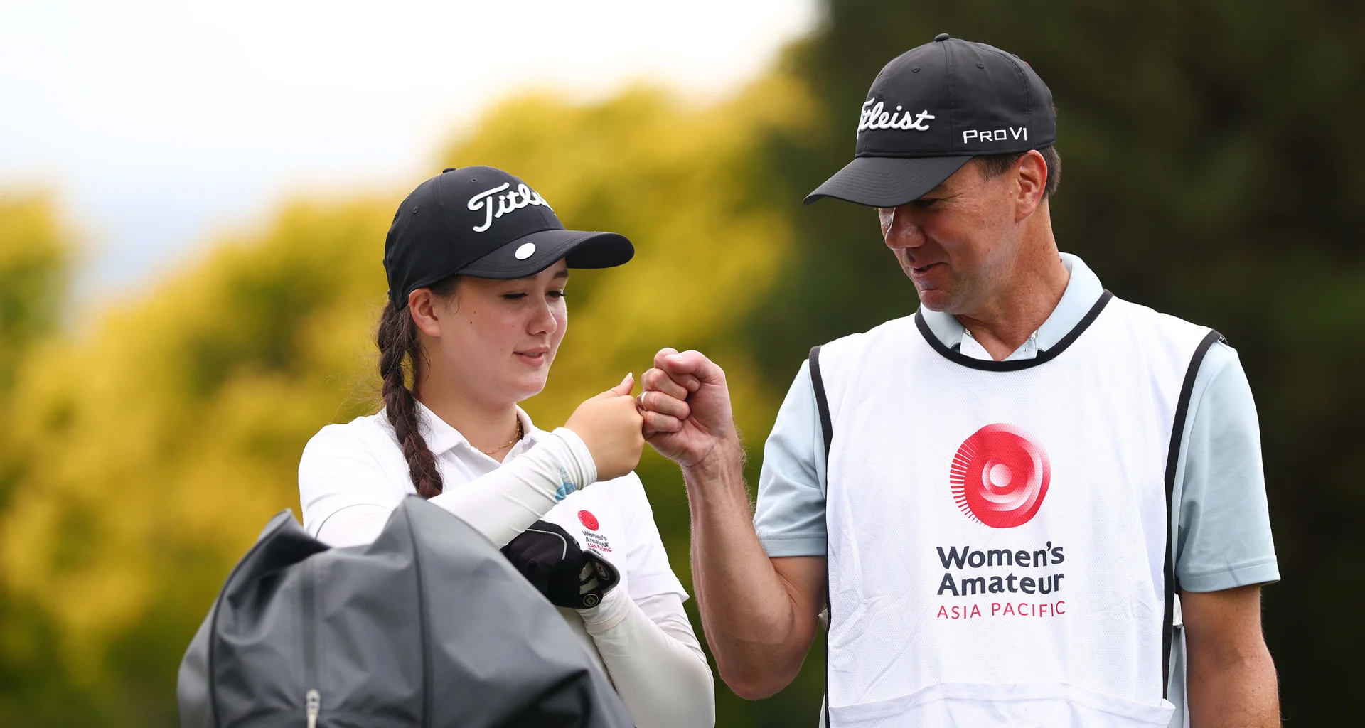 Elise Barber is fist bumps her caddie during day two of the 2026 Women's Amateur Asia-Pacific at Royal Wellington.