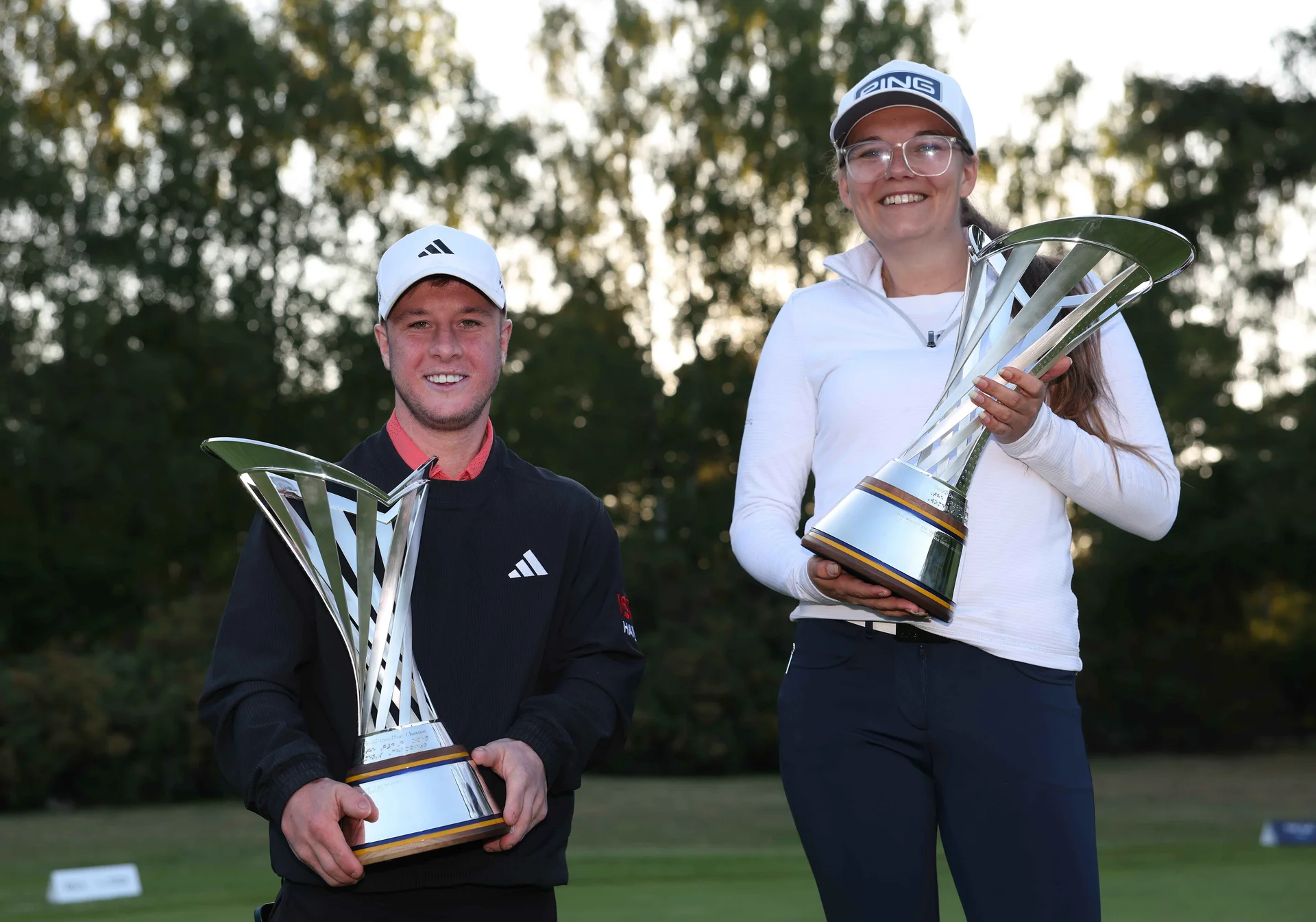 Brendan Lawlor of Carton House and Daphne van Houten of the Netherlands pictured with the G4D trophy and Women's G4D Trophy after winning the G4D Open at Woburn Golf Club