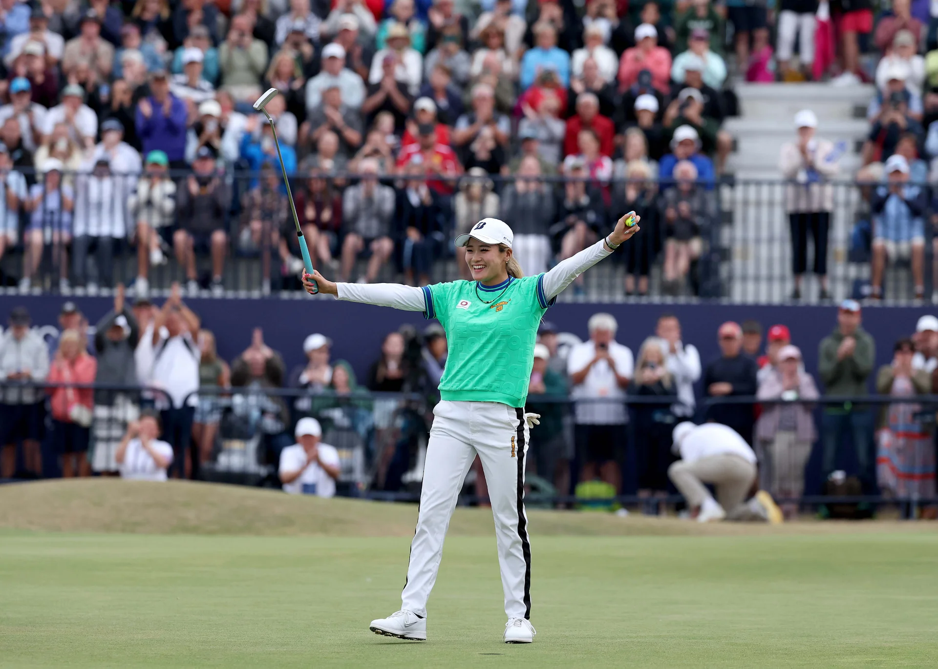Shiho Kuwaki of Japan celebrates holing the winning putt on the 18th green on the second hole of the play-off during the final round of the AIG Women's Open 2026.