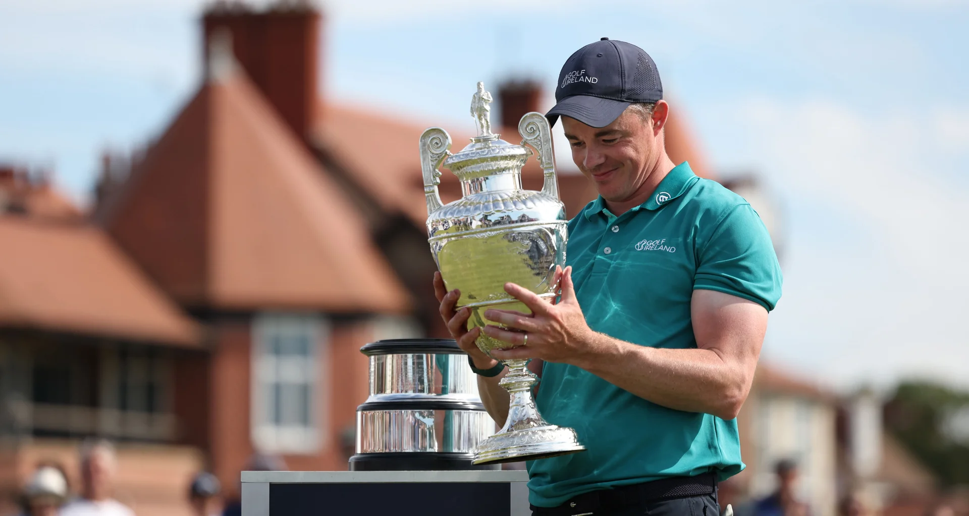 Stuart Grehan celebrates with the Amateur Championship trophy at Royal Liverpool.