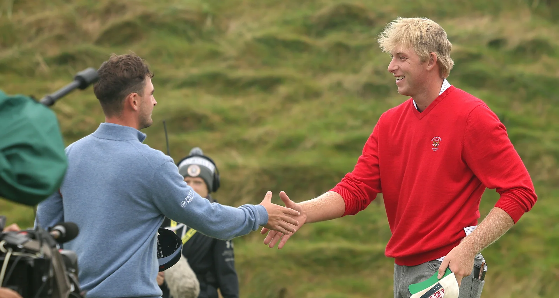 Jack Whaley and William Jennings shake hands after their match at the 2026 Walker Cup.