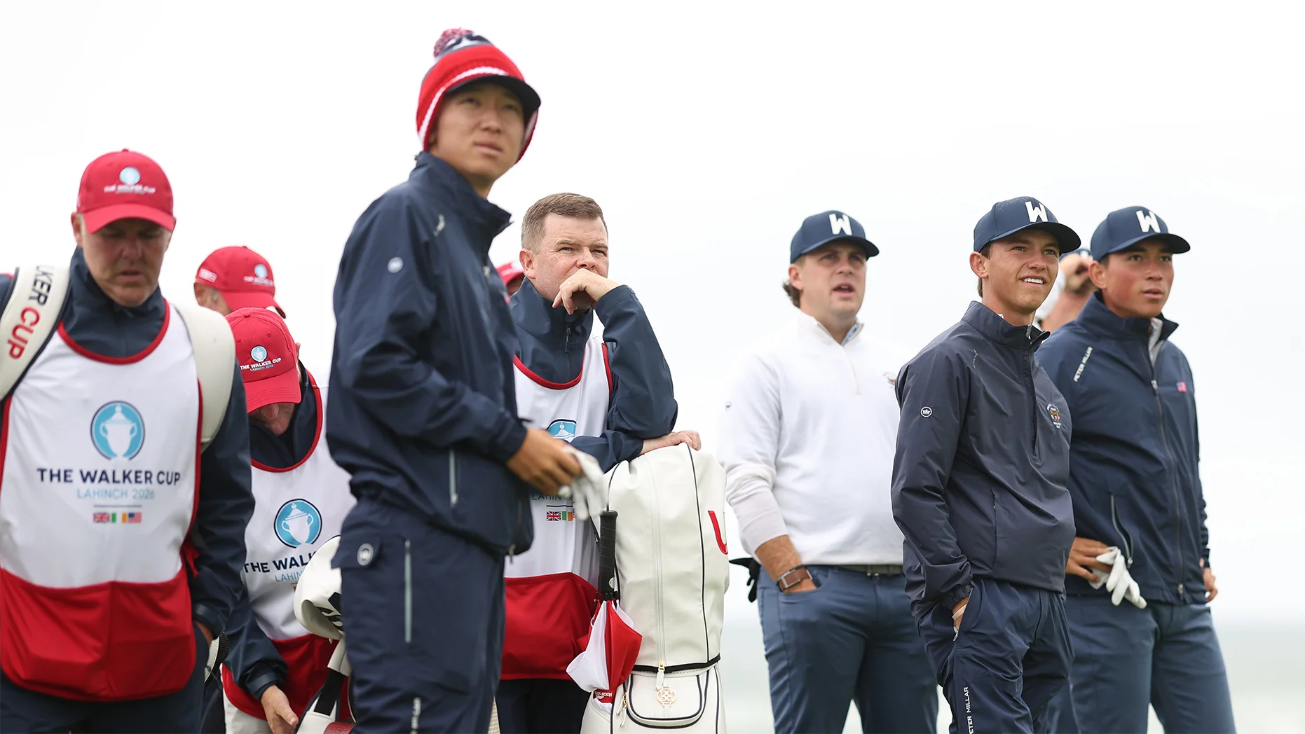 Members of the USA team watch a shot alongside their caddies at Lahinch ahead of the 51st Walker Cup.
