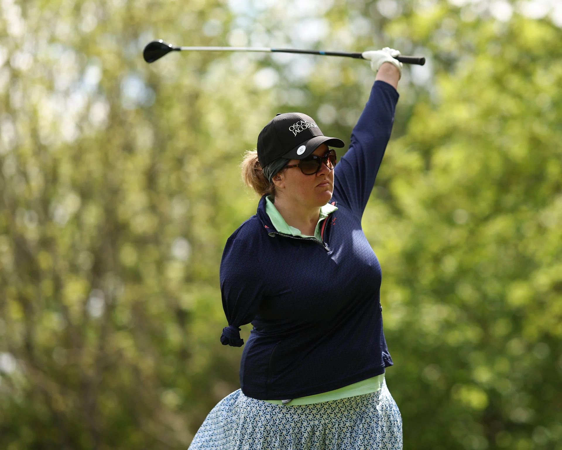 Lucy Leatham looks on after hitting a tee shot.