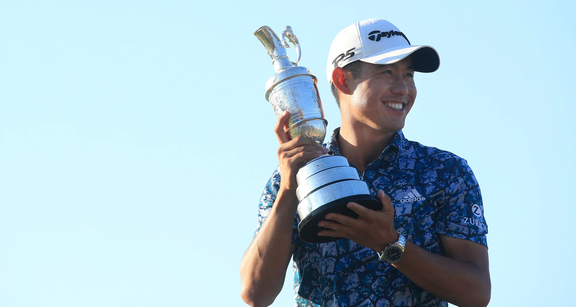 Collin Morikawa celebrates with the Claret Jug after winning The Open at Royal St George's.