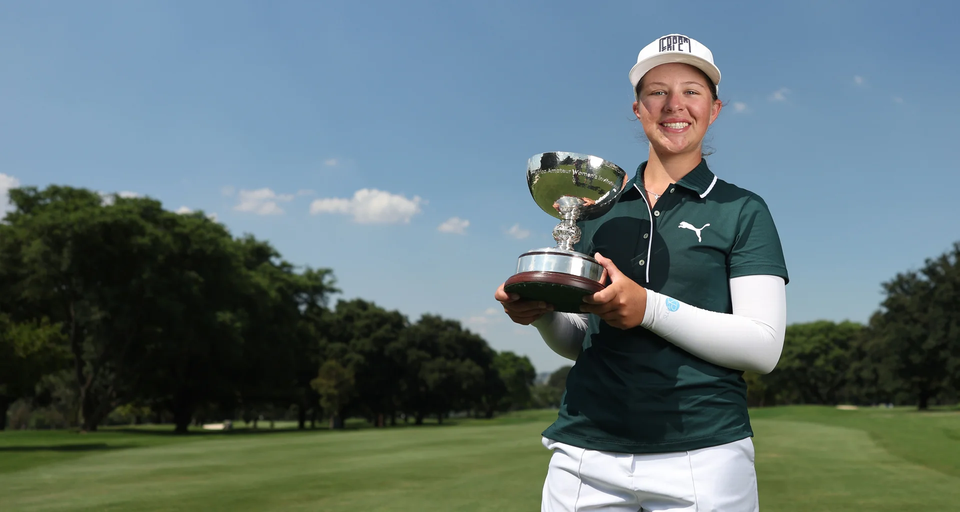 Lisa Coetzer celebrates with the Africa Amateur Women's Invitational trophy.