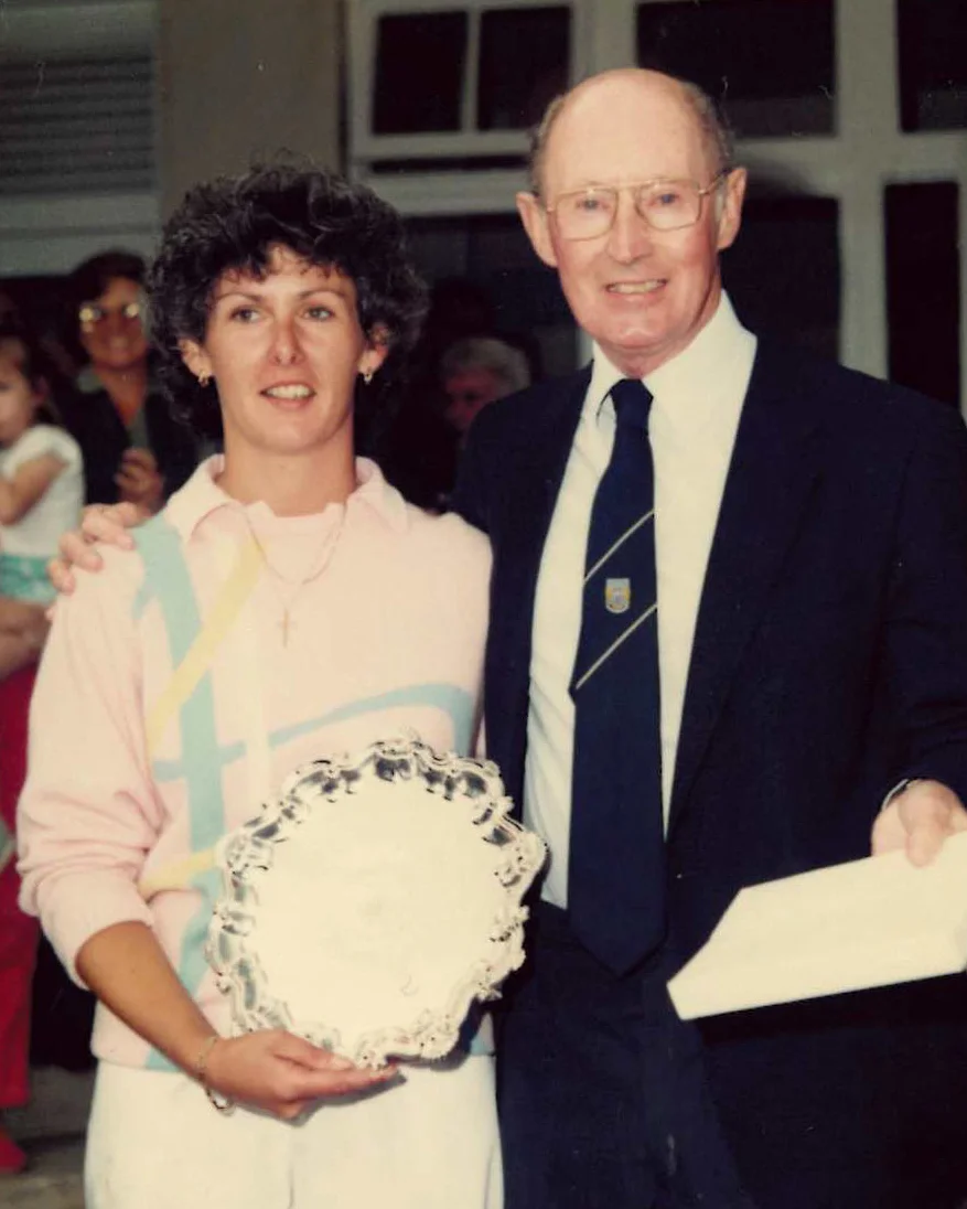 Claire Dowling poses for a photograph alongside a man after winning the strokeplay competition at the 1986 Women's Amateur Championship.