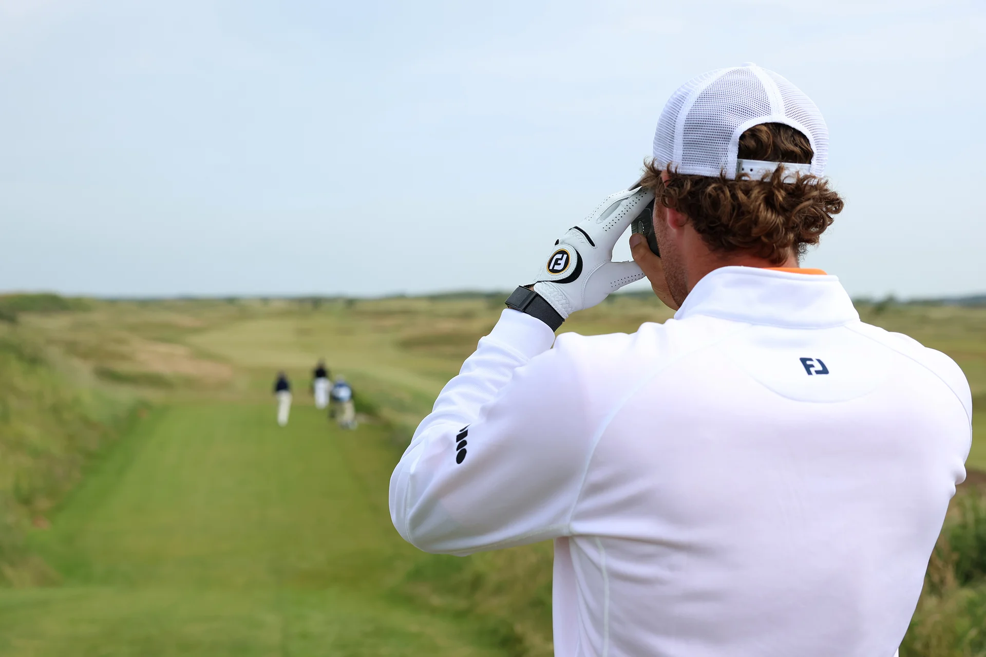 Benjamin Reuter of the Netherlands checks a yardage during Day One of the 2026 Amateur Championship at West Lancashire Golf Club.