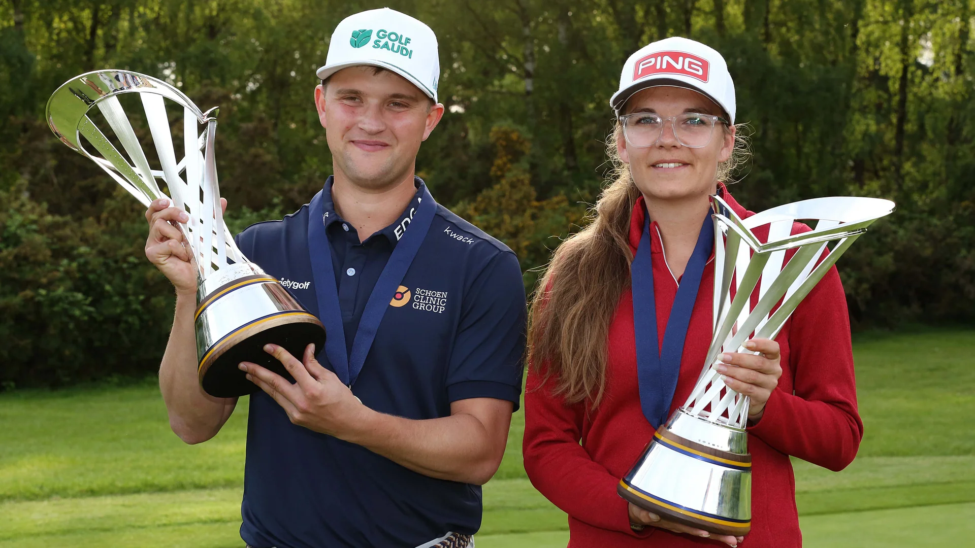 Kipp Popert and Daphne van Houten pose with their G4D Open trophies following victory at Woburn Golf Club.