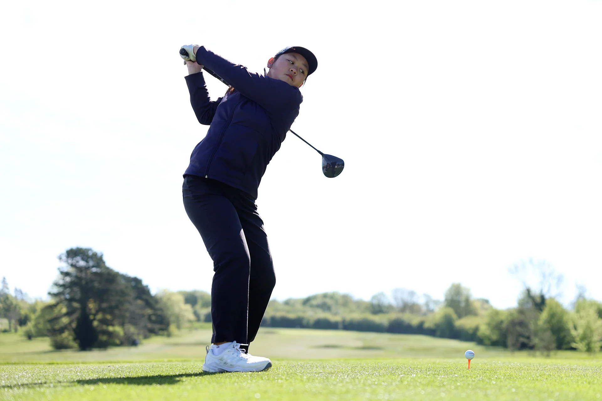 Sabrina Wong of Hong Kong, China tees off on the first hole during Day One of the R&A Girls U16 Amateur Championship at Gog Magog Golf Club.